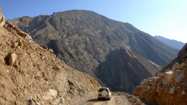 4x4 vehicle surrounded by mountains in the Hajar Mountains 