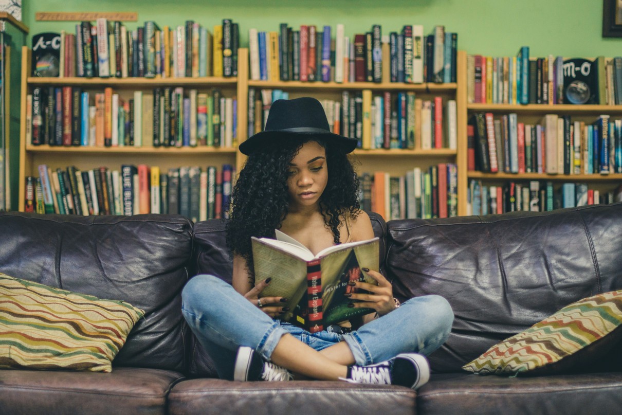 Young woman sitting and reading