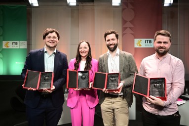The four prize winners holding their prizes