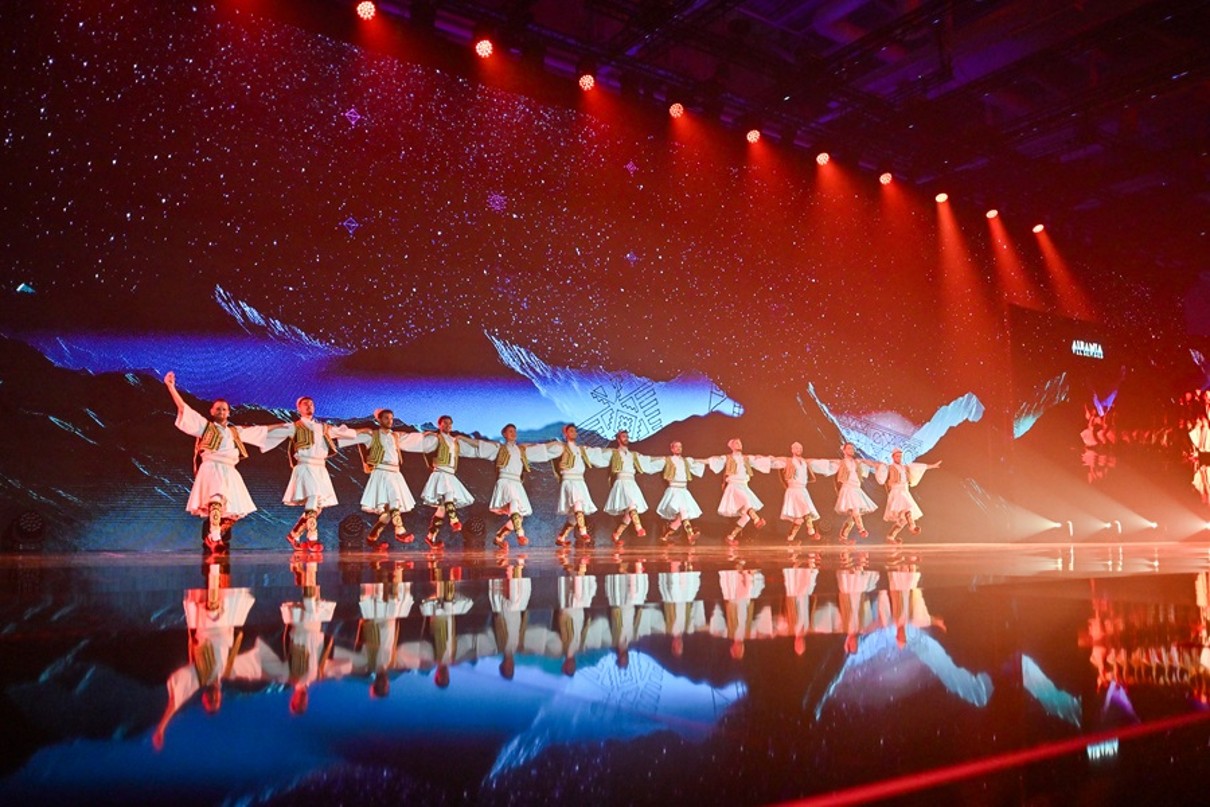 An Albanian folklore group takes to the stage and dances